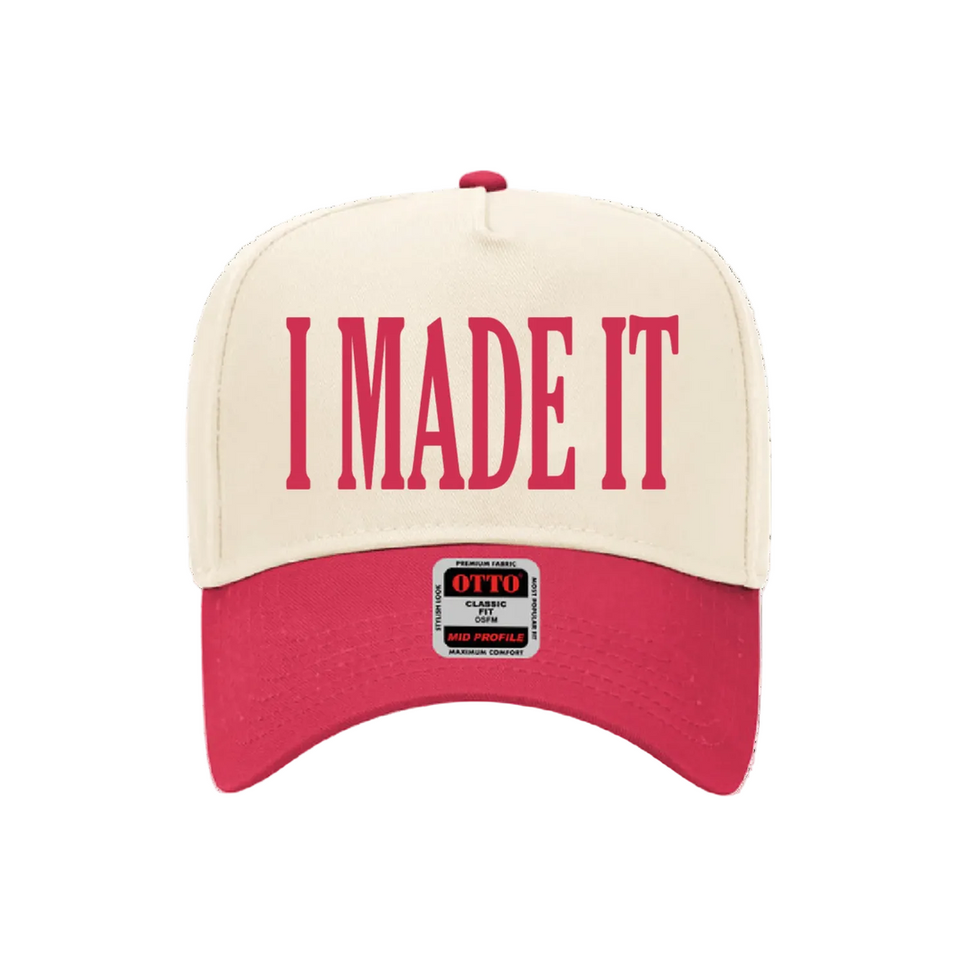 Beige and red cap with 'I MADE IT' text on a white background