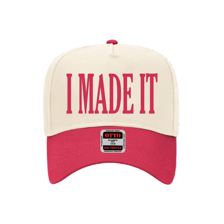 Beige and red cap with &