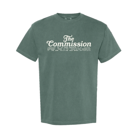 Green t-shirt with 'The Commission' text on a white background