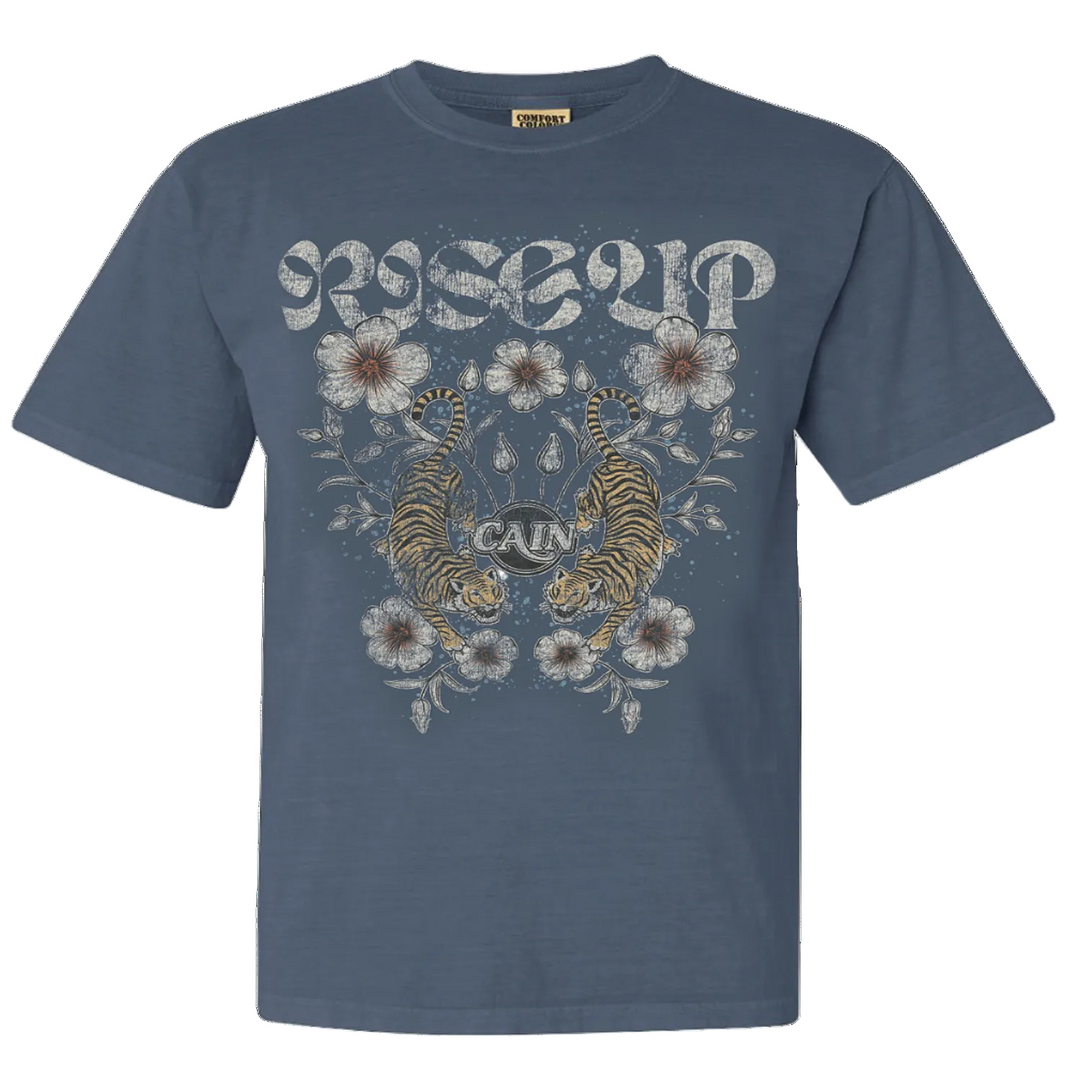 A blue crew neck t-shirt with a graphic print of tigers and flowers on the front.