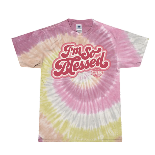 A tie-dye t-shirt with pink and yellow colors, featuring the text 'I'm So Blessed' in a large, decorative font.